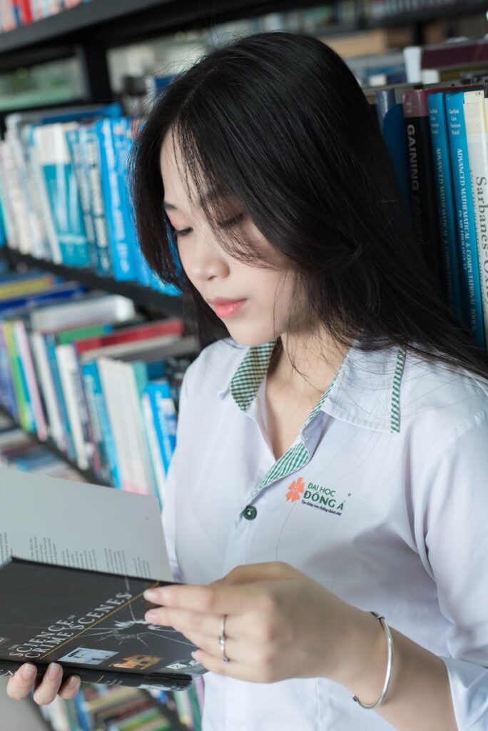 a woman looking at a book